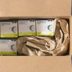 Paper cushioning being used to ship delicate products in an industrial application.